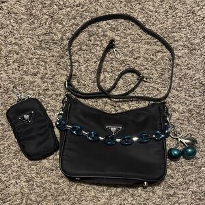 New Listing!!!
Black Crossbody Bag with Blue Chain Accent